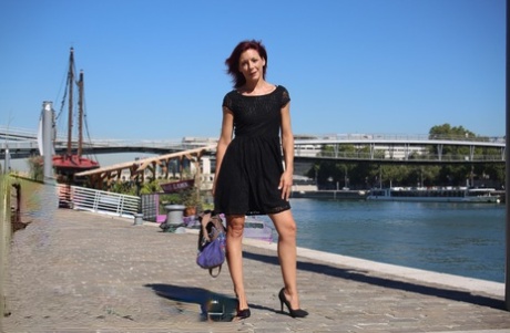 Sexy French redhead mature Morgane Dell flashes her cunt in public
