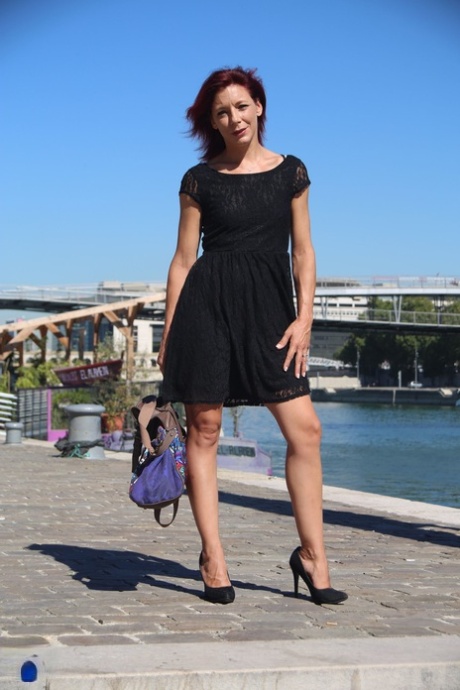 Sexy French redhead mature Morgane Dell flashes her cunt in public