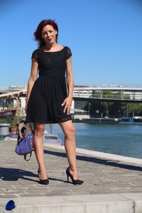 Sexy French redhead mature Morgane Dell flashes her cunt in public