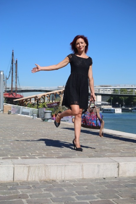 Sexy French redhead mature Morgane Dell flashes her cunt in public