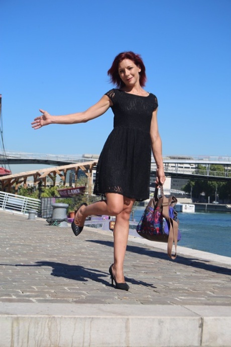 Sexy French redhead mature Morgane Dell flashes her cunt in public