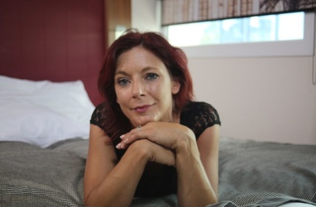 Sexy French redhead mature Morgane Dell flashes her cunt in public