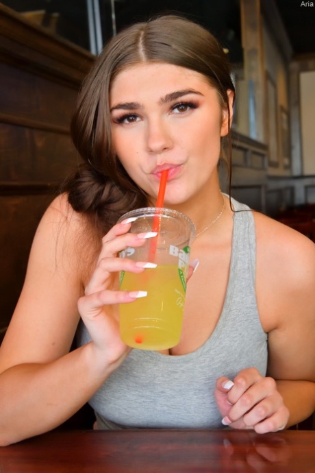 Cute girlfriend Aria uncovers her huge pierced boobs and flaunts them outdoors