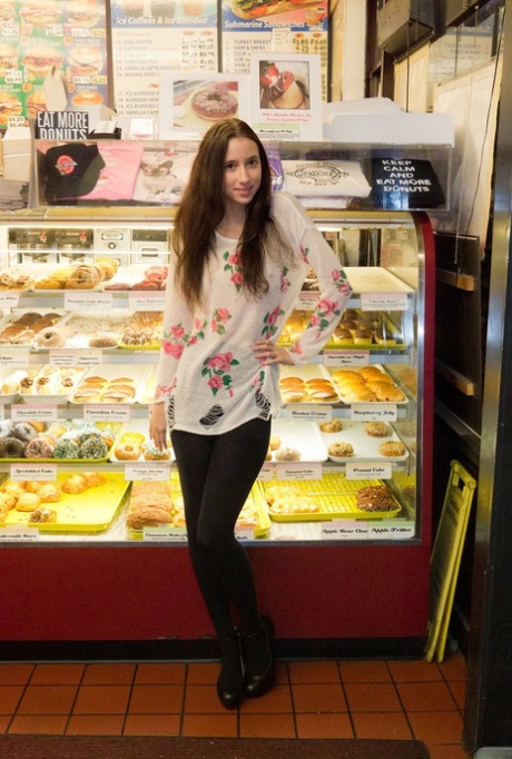 Naughty skinny chick Belle Knox flashes tits and ass in the local store