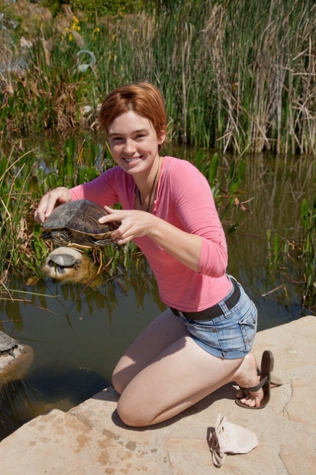 Hot redhead teen Jodie Taylor teasing outdoors with hot ass in short shorts