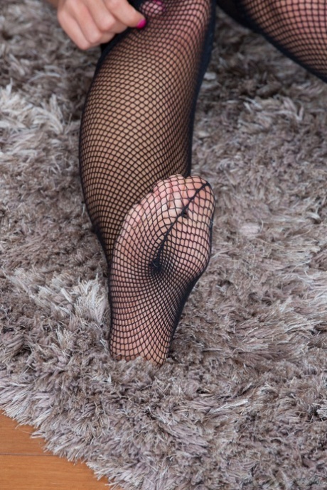 Blonde in fishnets Bunny shows her hairy twat and sticks a bottle up her ass