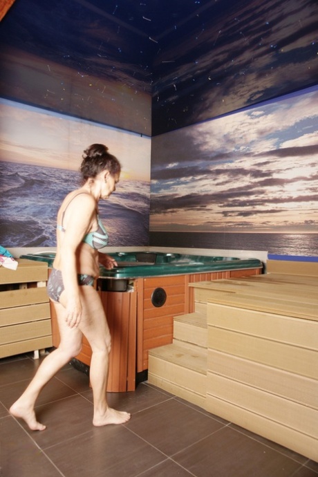 Mature brunettes with natural tits undress to hang out naked in the sauna