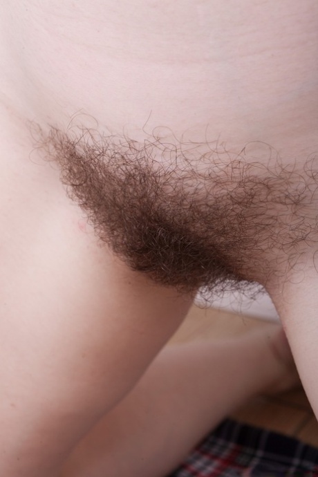 Petite teen with massive juggs Elouisa spreads legs and reveals hairy twat