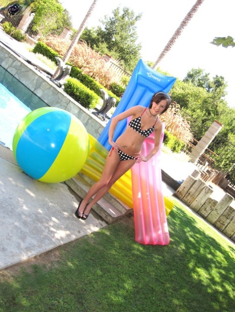 Brunette sweetie Kelly Klass removes her bikini and shows her tiny tits