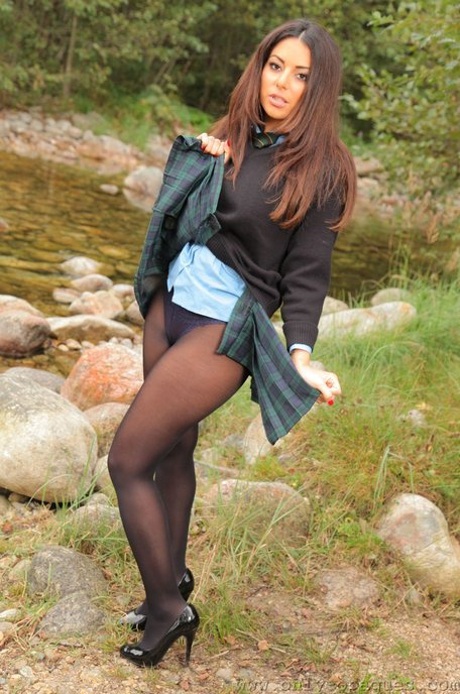 Hot babe in pantyhose Charley S flaunts her sexy big tits by the river