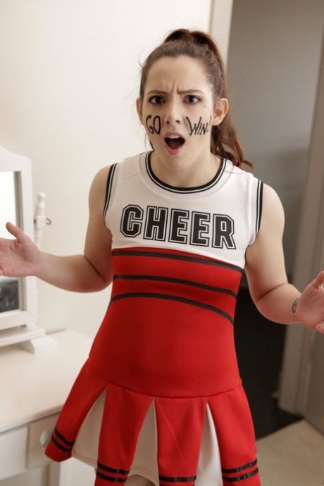 Slutty blonde cheerleader interrupts practice to fuck stepbrother for creampie
