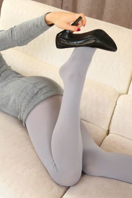 Hot model Zofeya showcasing her huge natural tits while posing in grey tights