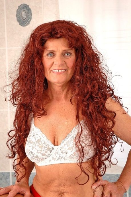 Long haired redhead granny Tammy gets hairy pussy banged in the bathroom