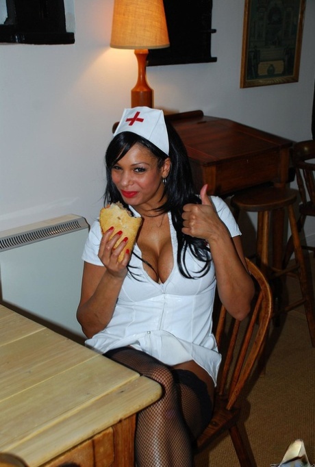 Ebony nurse India shows her magical tits and touches herself in hot uniform