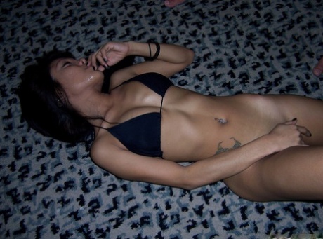 Horny Filipina Roseanne strips and showcases her skinny tattooed body