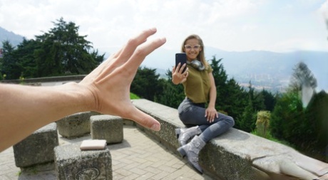 Veronica Leal posing all over her hood in green shirt and tight jeans