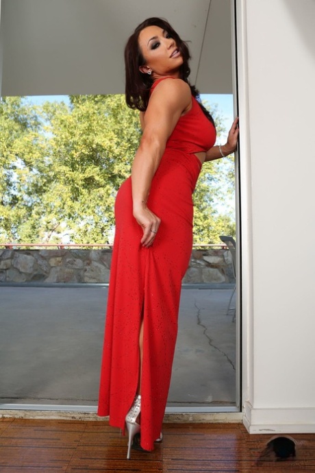 Muscular brunette MILF Brandi Mae drops her red dress & masturbates with a toy
