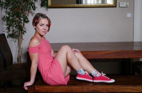 Petite teen Sasha Zima strips her pink dress and teases with her small titties