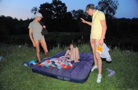 Alluring teen Oksana enjoying hardcore sex in an outdoor 3some with two studs
