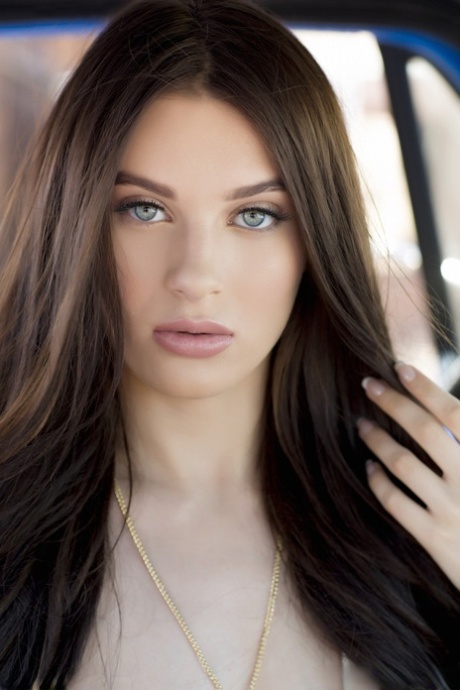 American chick Lana Rhoades shows her big natural tits and twat outdoors