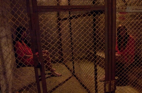 Slutty inmates show their tits while changing into their prison uniforms