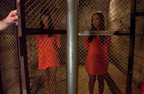 Slutty inmates show their tits while changing into their prison uniforms