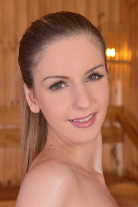 Hot amateur babe Stella Cox plays with her big tits and pussy in the sauna