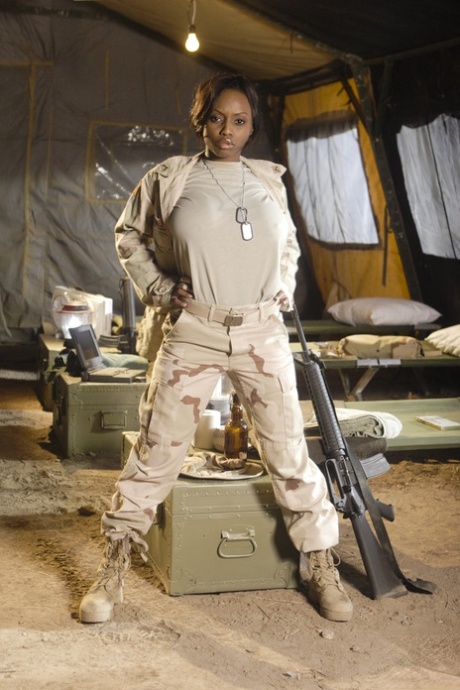Ebony military girl Jada Fire doffs her uniform & shows off her exotic tits