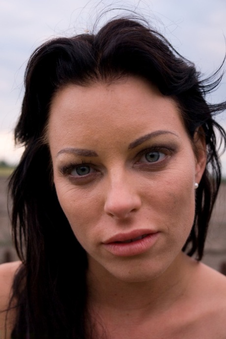 Raven-haired lesbians get involved in an outdoor threesome at a farm