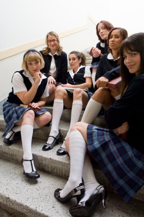 Redheaded teacher with big tits Kylie Ireland spanks a hot schoolgirl