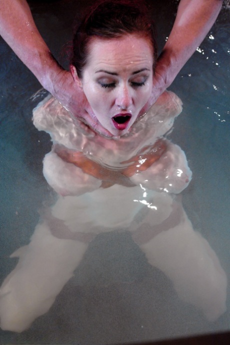 Redheaded MILF with big tits Mz Berlin gets toyed under water while tied up