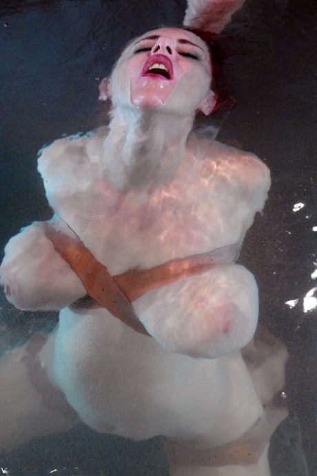 Redheaded MILF with big tits Mz Berlin gets toyed under water while tied up