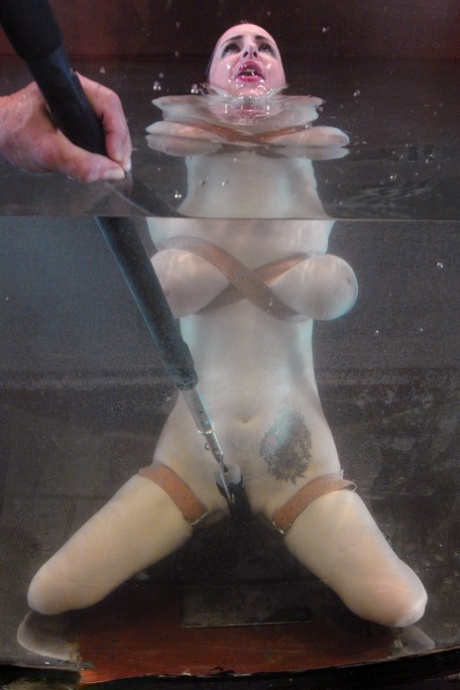 Redheaded MILF with big tits Mz Berlin gets toyed under water while tied up