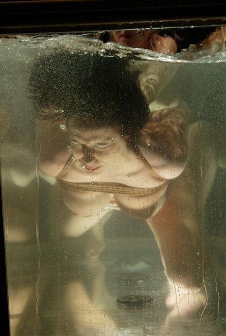 Sexy girl Sasha Sparks gets her twat toyed under water by a domme