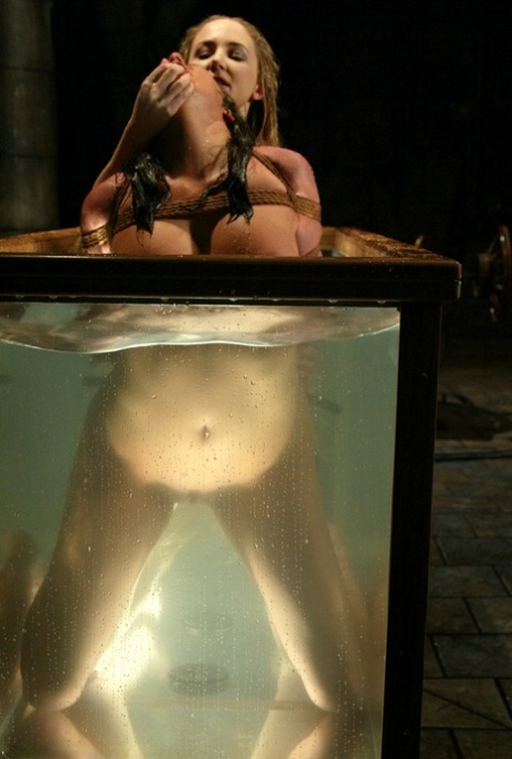 Sexy girl Sasha Sparks gets her twat toyed under water by a domme