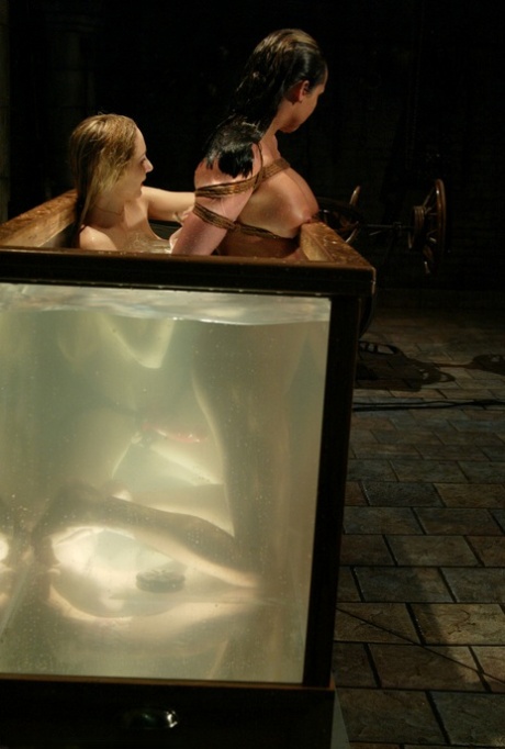 Sexy girl Sasha Sparks gets her twat toyed under water by a domme