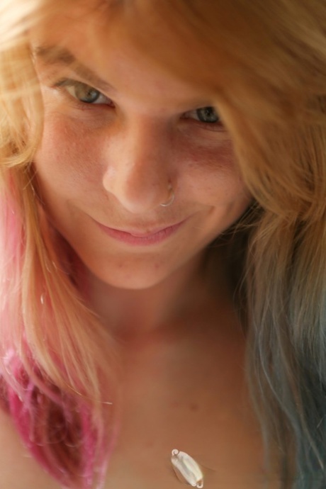 Blondie Ophelia Rose takes off her clothes, shows her puffy nipples and ass