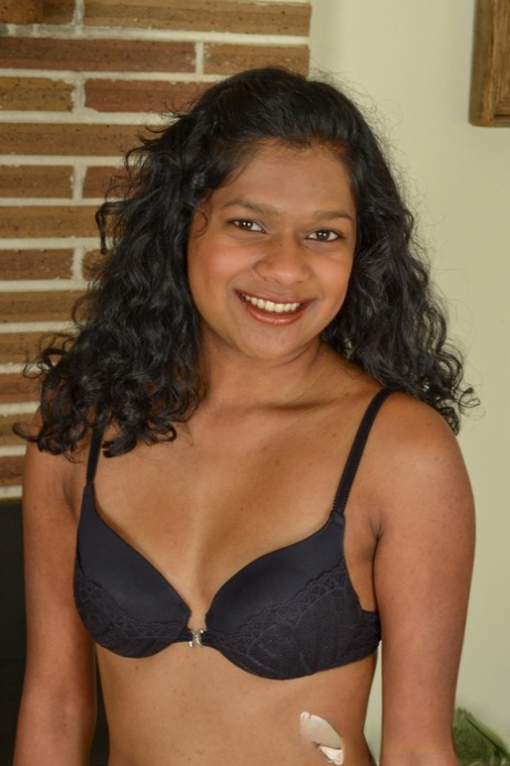 Indian with black haired Leilah doffs her underwear and squeezes her vagina