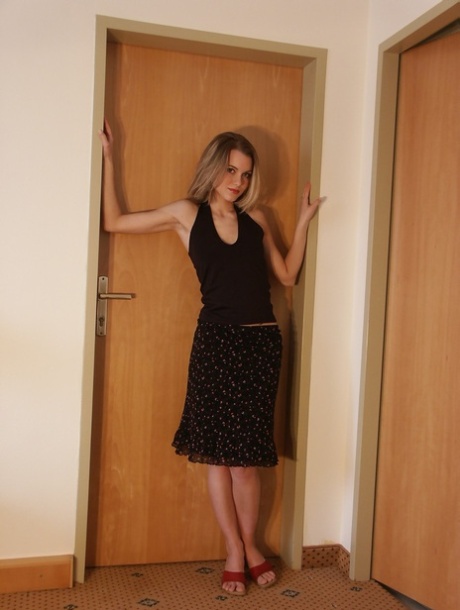 Horny teen Jenni removes her black outfit and flaunts her amazing ass