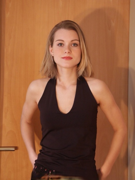 Horny teen Jenni removes her black outfit and flaunts her amazing ass
