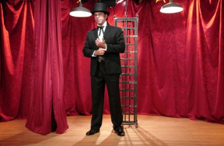 Skinny Asian Soolin Kelter gets caged during a magician's performance