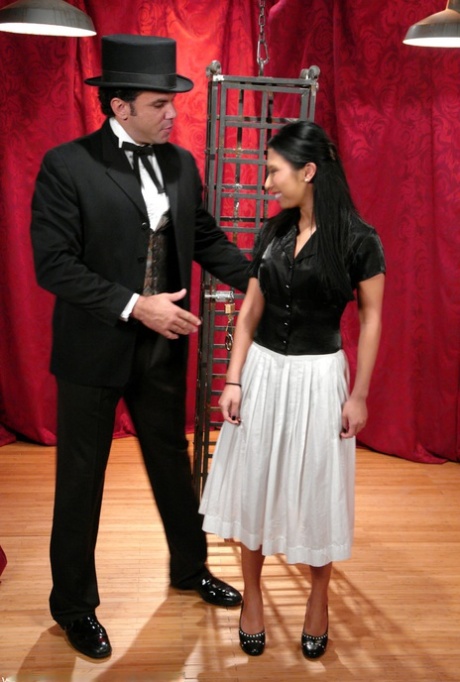 Skinny Asian Soolin Kelter gets caged during a magician's performance
