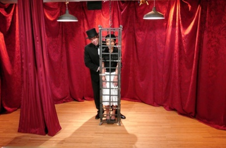 Skinny Asian Soolin Kelter gets caged during a magician's performance