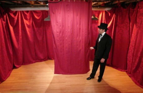 Skinny Asian Soolin Kelter gets caged during a magician's performance