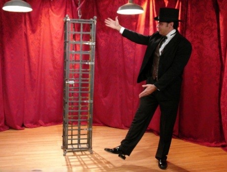 Skinny Asian Soolin Kelter gets caged during a magician's performance