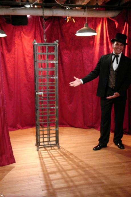 Skinny Asian Soolin Kelter gets caged during a magician's performance