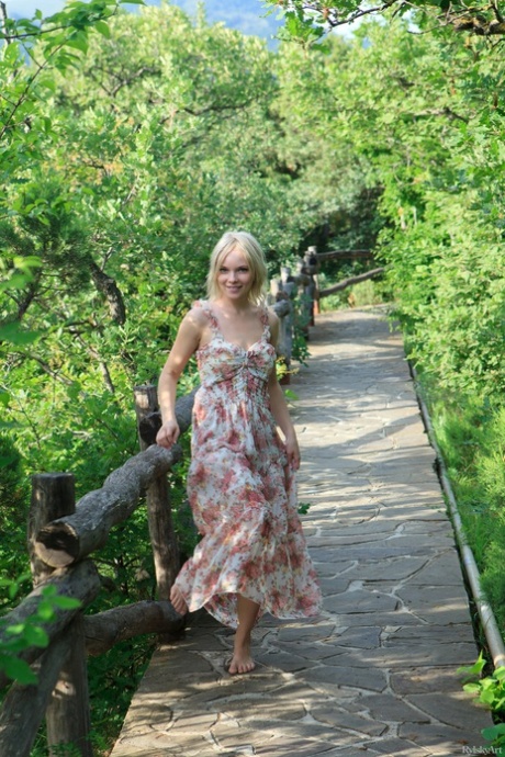 Blonde Feeona flashes her pussy in public while posing pantyless