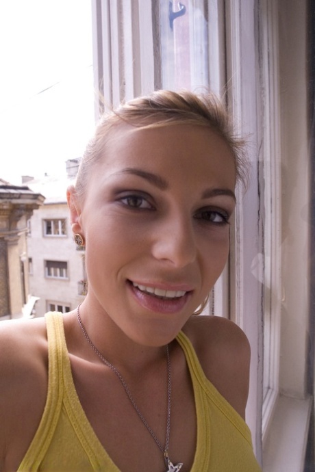 Romanian beauty Jennifer Love crawling on the street ball-gagged and shackled