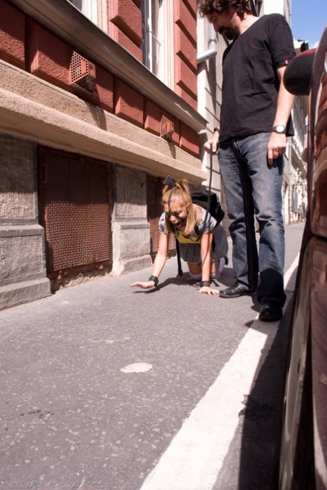 Romanian beauty Jennifer Love crawling on the street ball-gagged and shackled