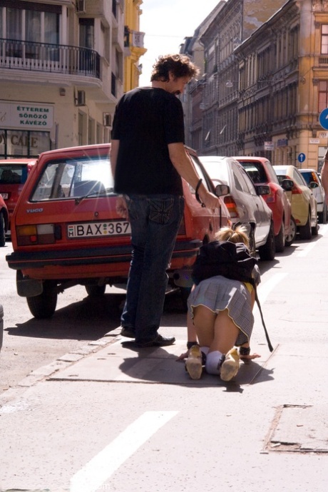 Romanian beauty Jennifer Love crawling on the street ball-gagged and shackled
